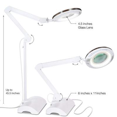 magnifying glass with light on a stand
